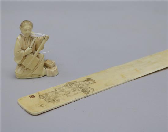 A Japanese Ivory page turner with Russian inscription and an Ivory okimono 45cm